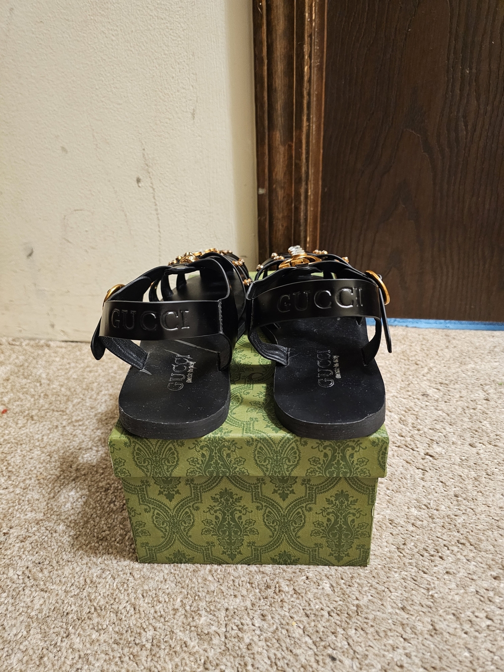 Gucci Black Sandals with Gold Embellishments